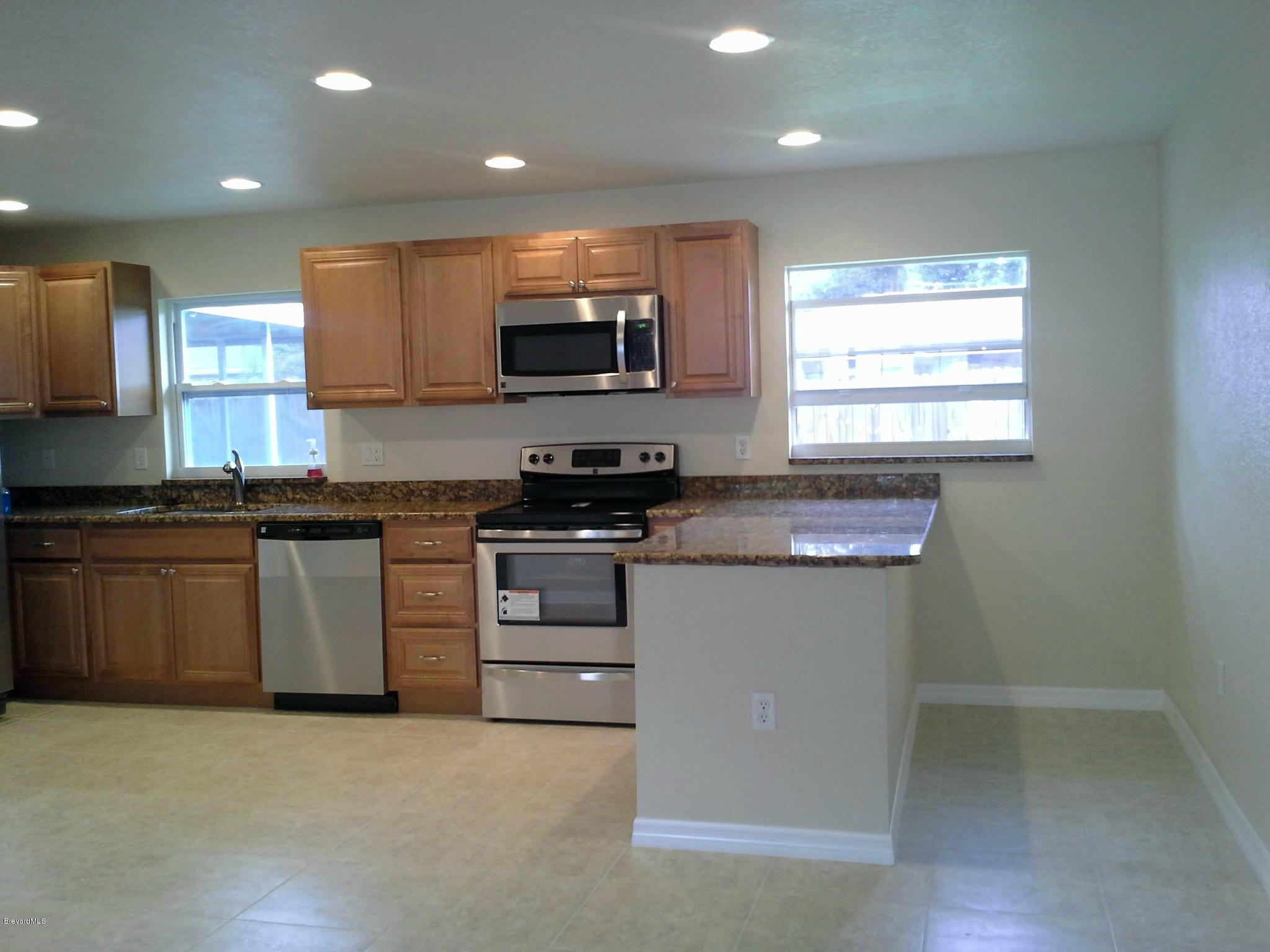 942 Kings Post Road Rockledge, FL 32955 - Photo 7 of 12 Kitchen 2