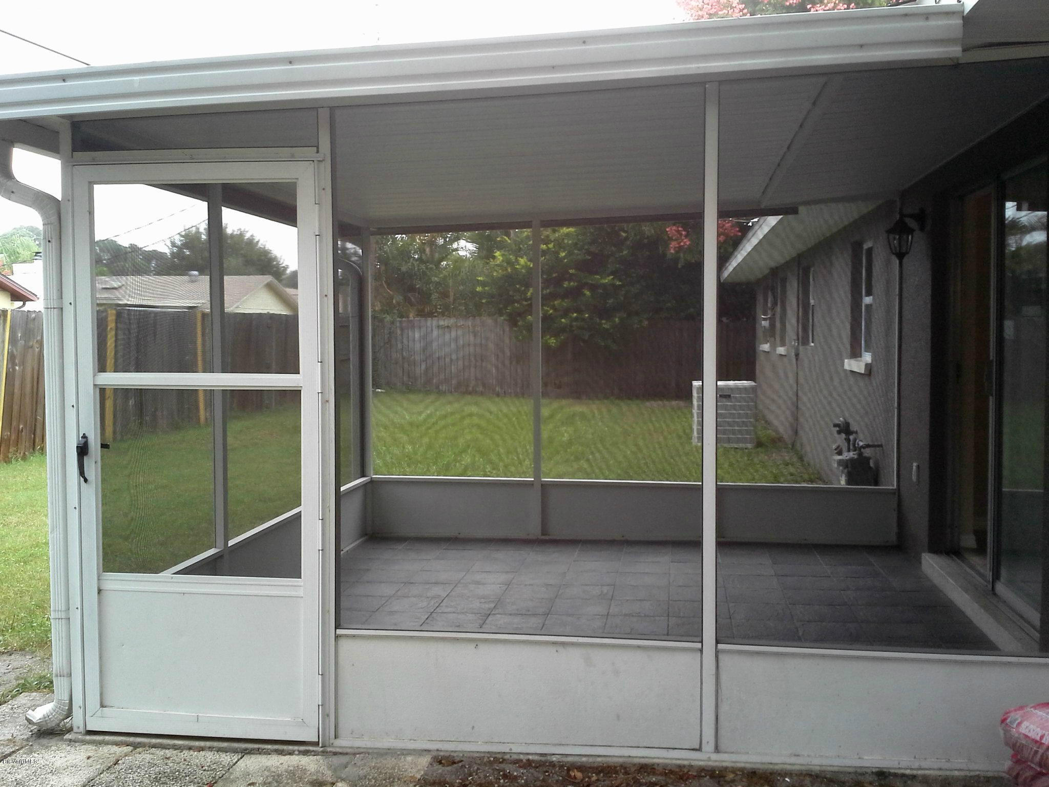 942 Kings Post Road Rockledge, FL 32955 - Photo 9 of 12 Screened Porch