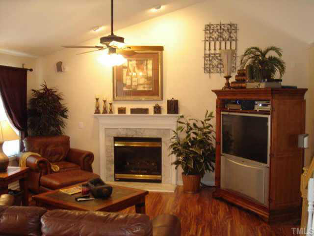 4335 Mantua Way Raleigh, NC 27604 - Photo 3 of 6 a living room with furniture and a fireplace