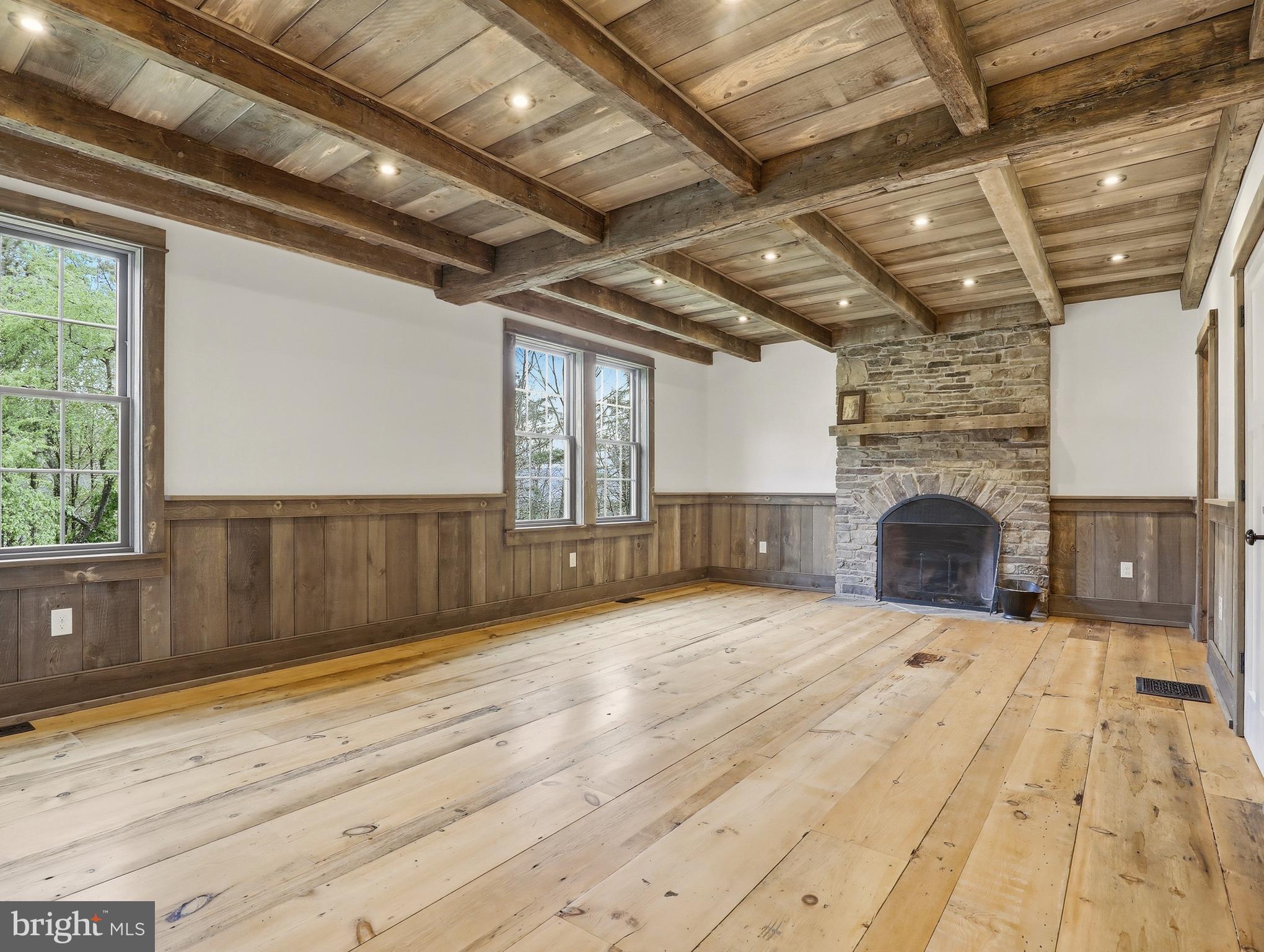 755 Grammer Road Williamsport, PA 17701 - Photo 16 of 81 a view of empty room with wooden floor and fireplace