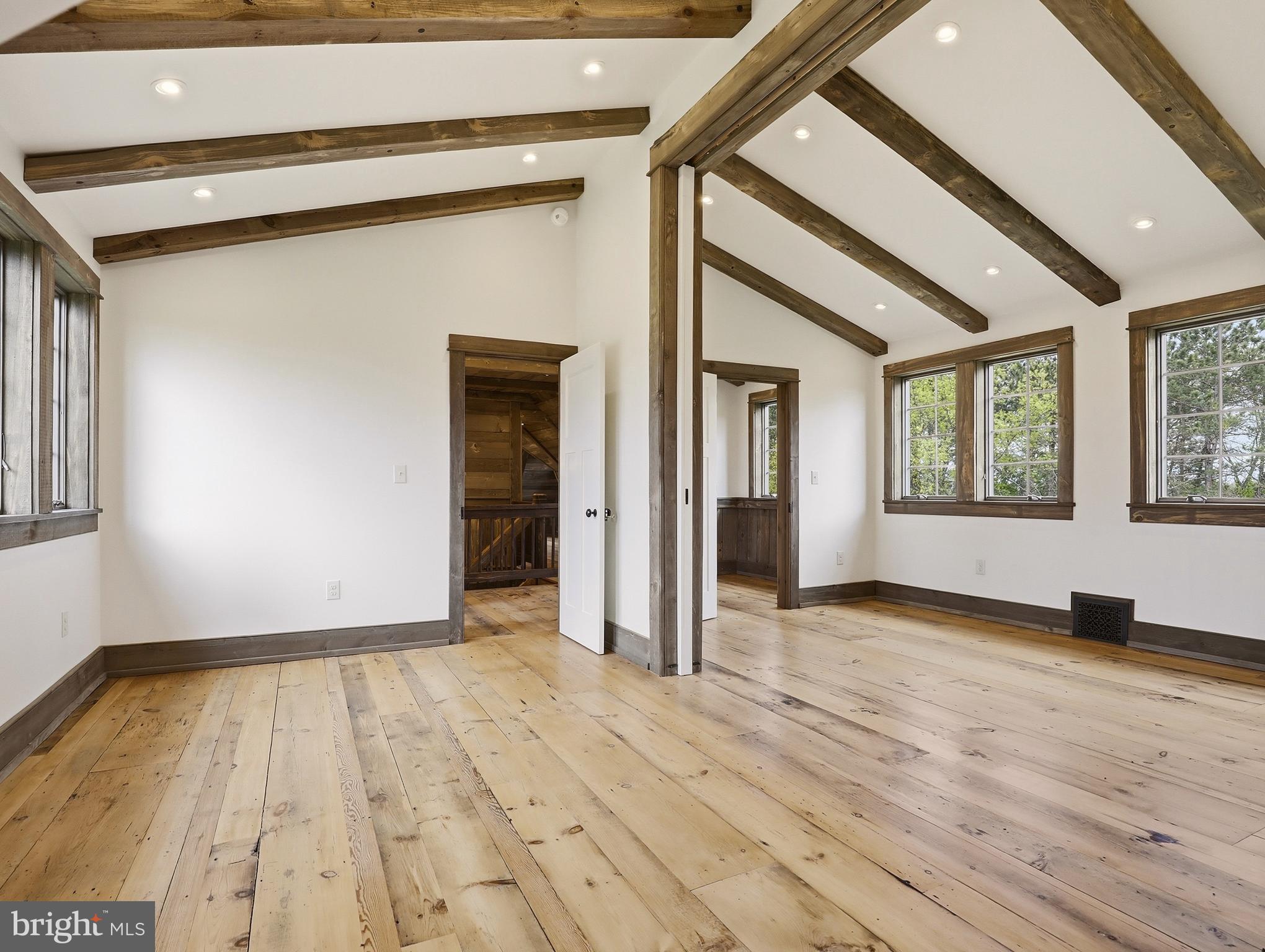 755 Grammer Road Williamsport, PA 17701 - Photo 28 of 81 a view of an empty room with wooden floor and a window