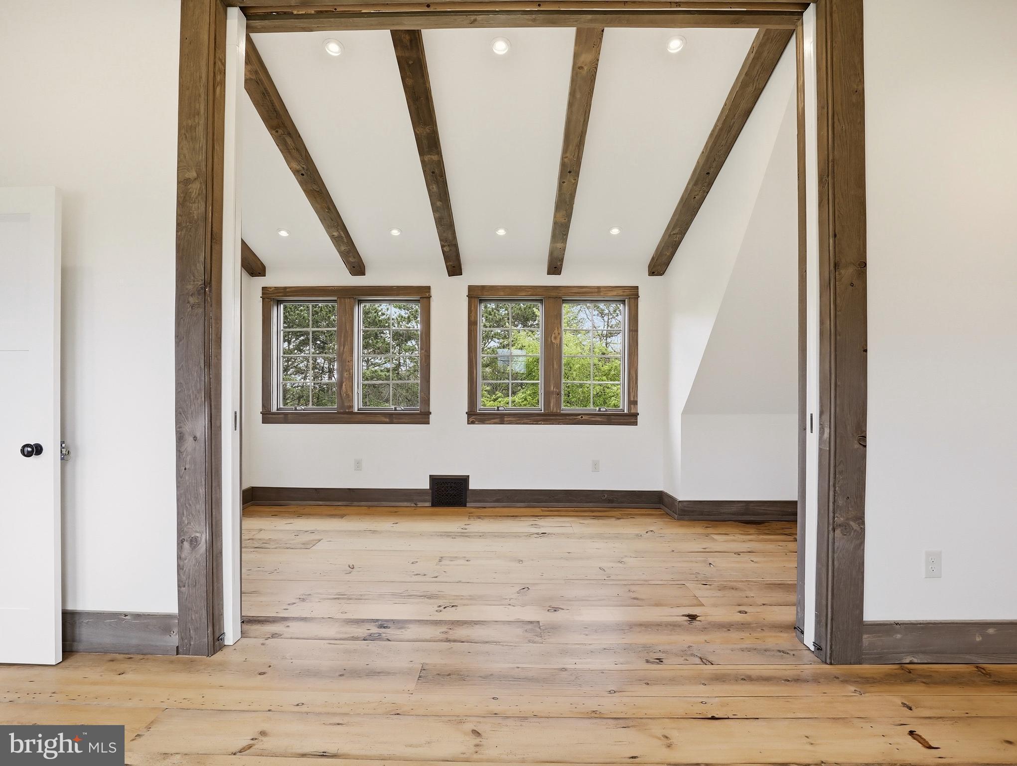 755 Grammer Road Williamsport, PA 17701 - Photo 29 of 81 a view of an empty room with wooden floor and windows