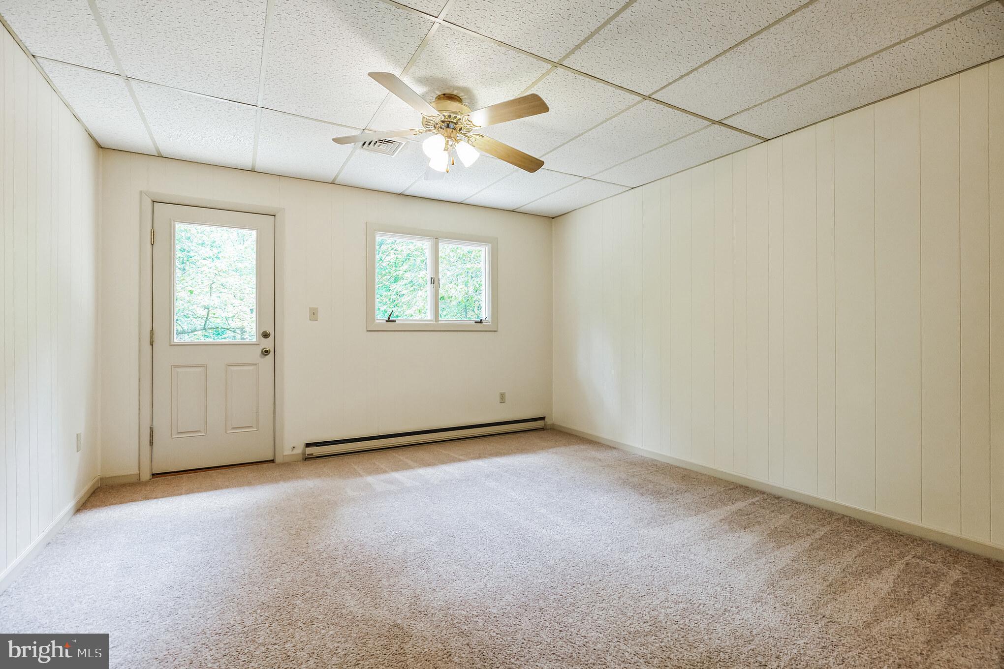 11425 Mill Bridge Road Lusby, MD 20657 - Photo 16 of 40 an empty room with windows