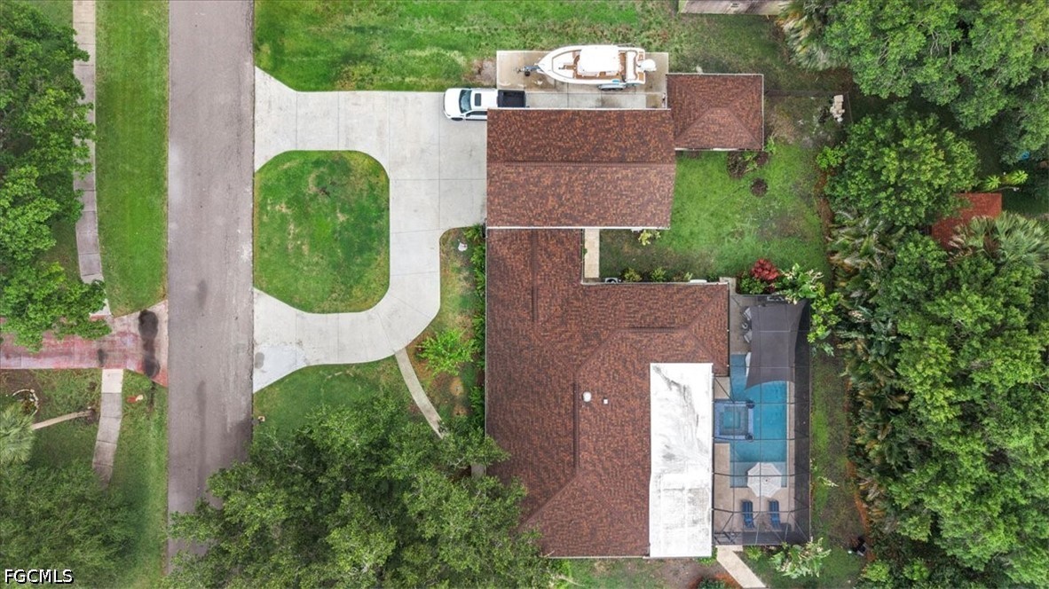 202 Ridgewood Avenue Clewiston, FL 33440 - Photo 7 of 50 an aerial view of a house with garden space and a swimming pool