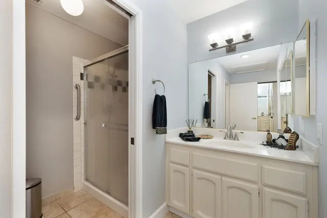 a bathroom with a double vanity sink and mirror