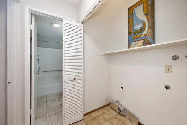 a view of a bathroom from a hallway