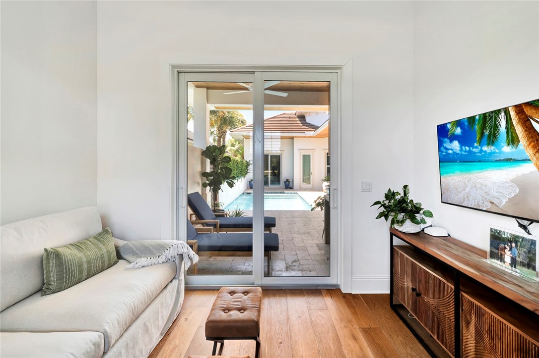 11 Caribe Way Vero Beach, FL 32963 - Photo 13 of 31 a living room with furniture and a wooden floor