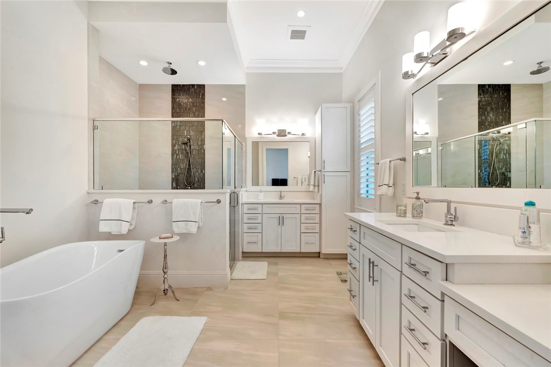 11 Caribe Way Vero Beach, FL 32963 - Photo 17 of 31 a bathroom with a double vanity sink mirror and bathtub