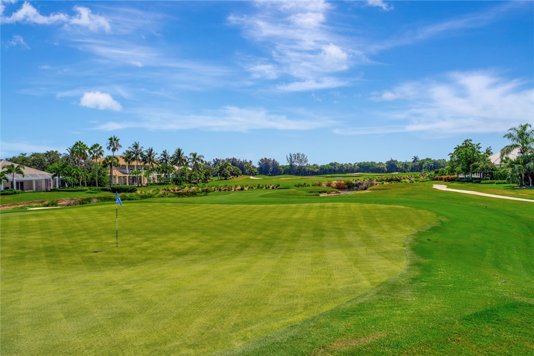 11 Caribe Way Vero Beach, FL 32963 - Photo 26 of 31 a view of a lake with houses in the background
