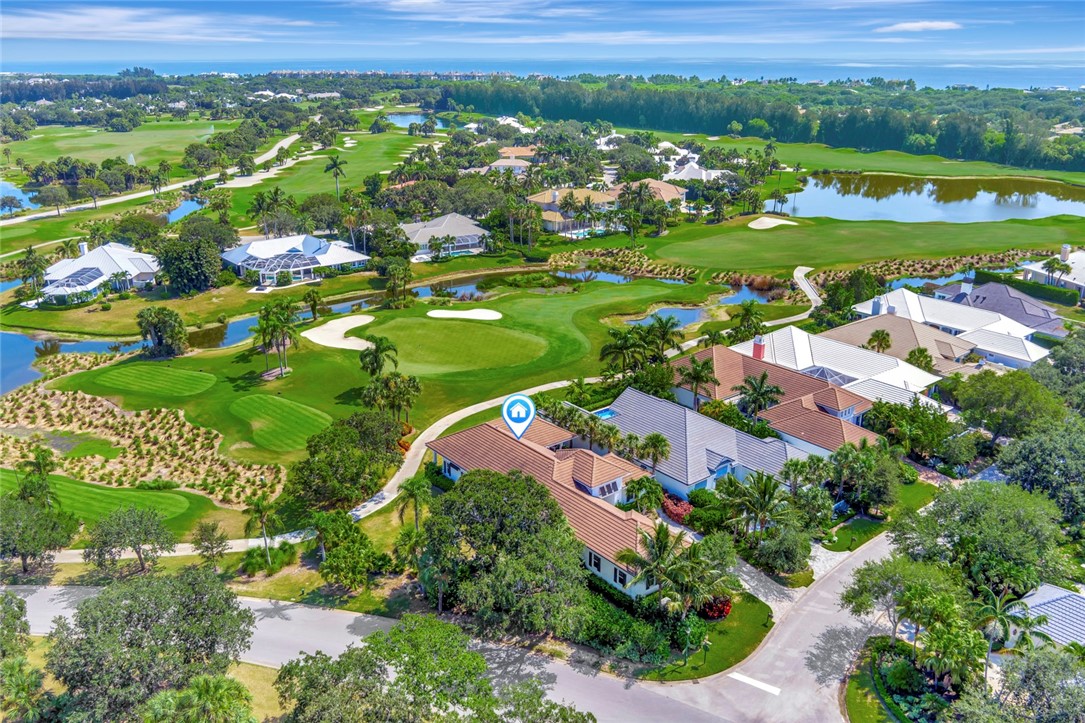 11 Caribe Way Vero Beach, FL 32963 - Photo 28 of 31 an aerial view of city lake and trees all around