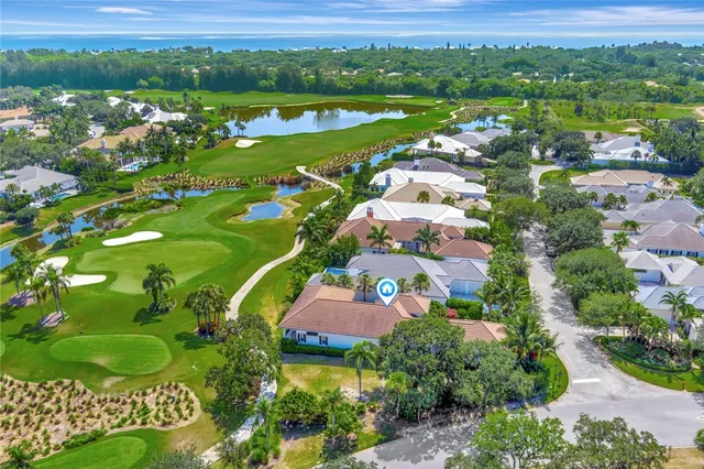 an aerial view of lake residential houses with outdoor space and swimming pool