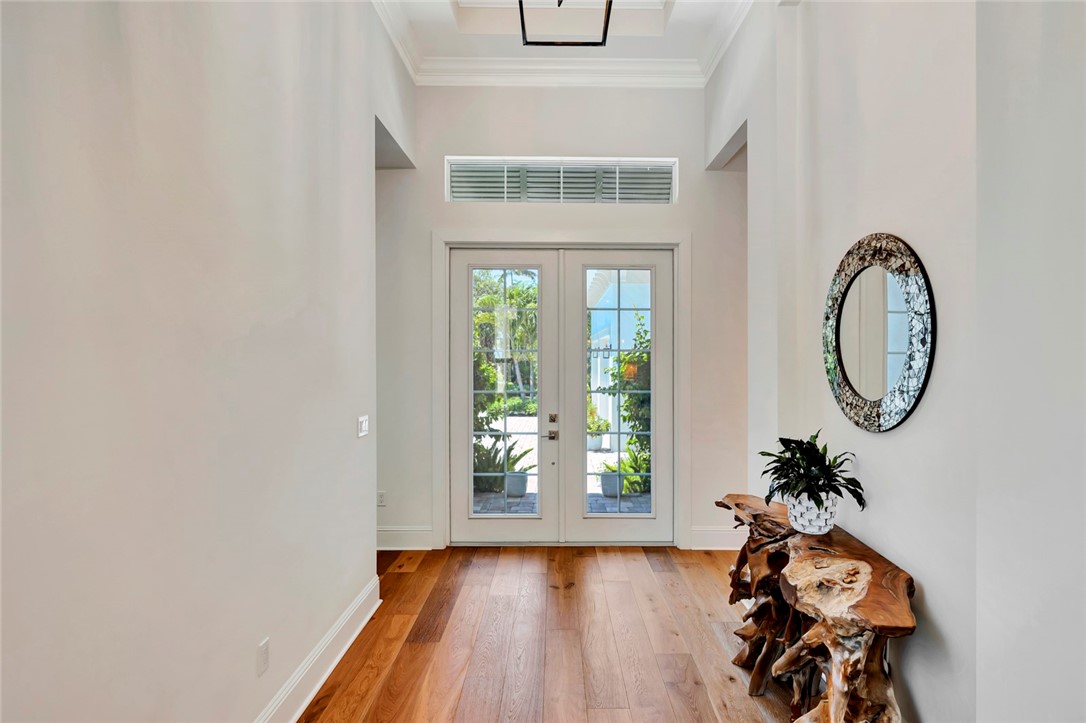 11 Caribe Way Vero Beach, FL 32963 - Photo 8 of 31 a view of a hallway with wooden floor and a window