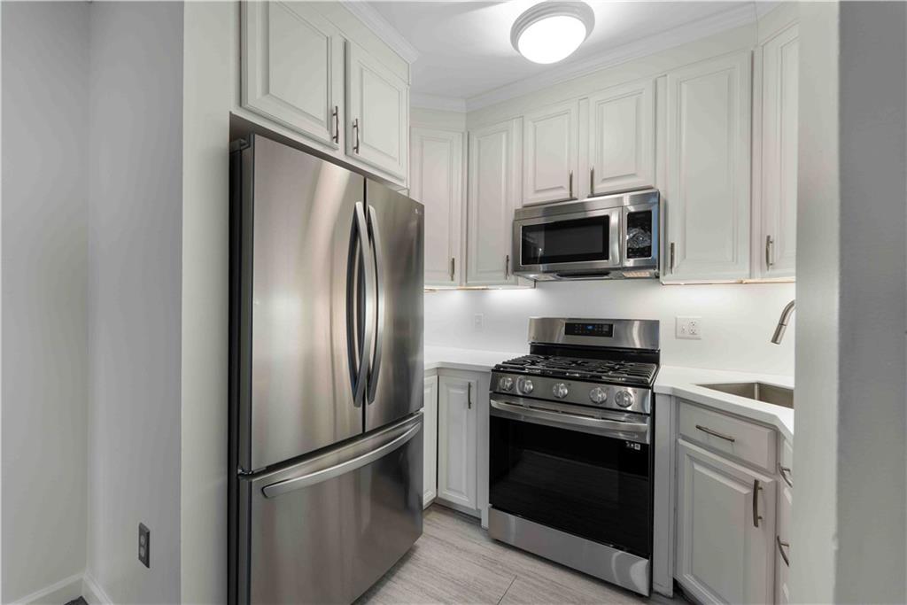 363 4th Street, Unit 6 Beaver, PA 15009 - Photo 16 of 34 Included are the stainless steel refrigerator with bottom freezer, 6-burner gas stove w/convection oven, built-in microwave and dishwasher and a brand new garbage disposal!