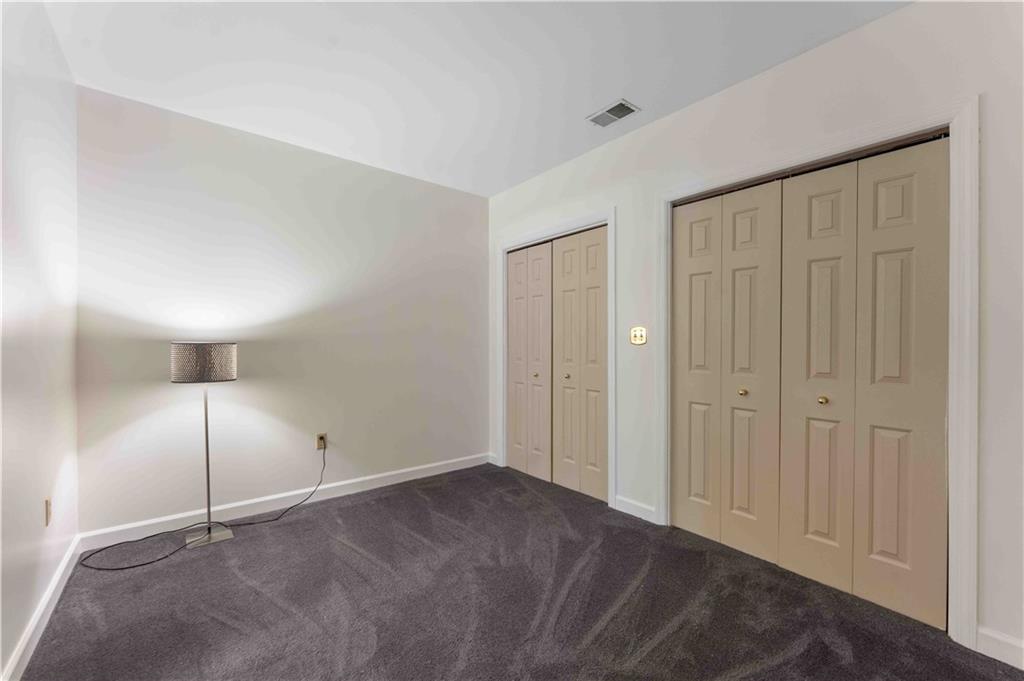 363 4th Street, Unit 6 Beaver, PA 15009 - Photo 22 of 34 The Guest Bedroom offers a wall of closet space, newer carpeting and freshly painted and cleaned!