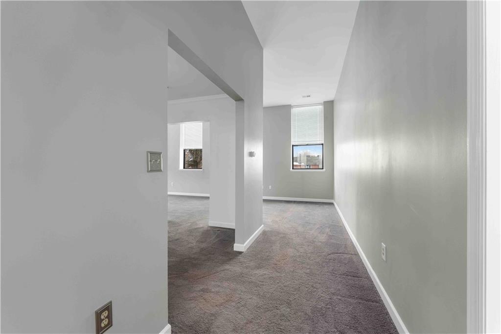 363 4th Street, Unit 6 Beaver, PA 15009 - Photo 7 of 34 Drenched in sunlight from all angles, the living areas have newer, professionally cleaned wall-to-wall carpeting, newer blinds and a flowing design.