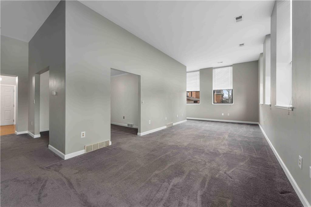 363 4th Street, Unit 6 Beaver, PA 15009 - Photo 10 of 34 The expansive living room is filled with natural light from a wall of large windows and offers exceptional flexibility.