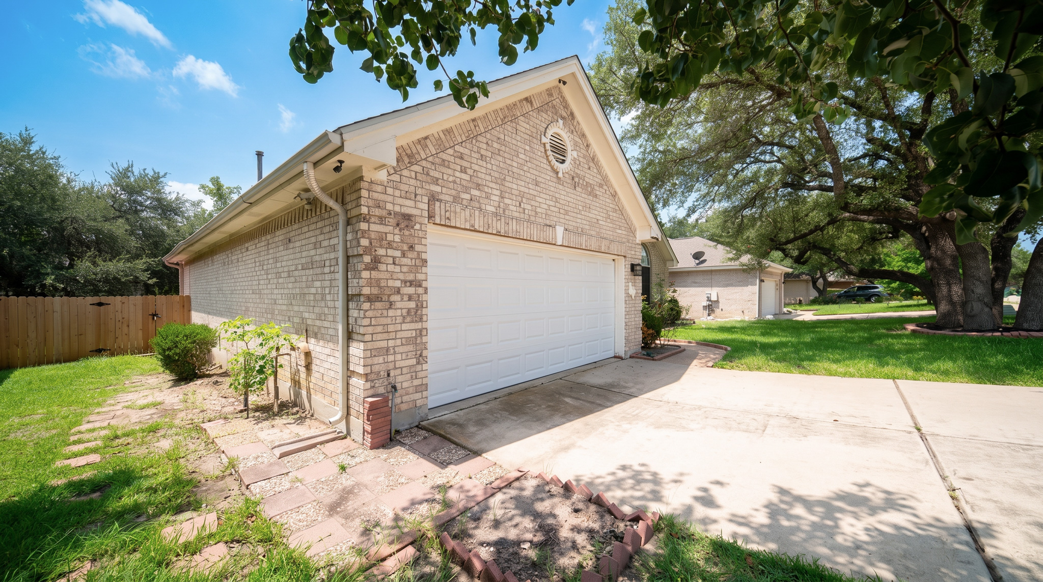 1108 Antelope Ridge Cedar Park, TX 78613 - Photo 16 of 27 A well-maintained brick facade and an attached garage with a concrete driveway welcome you home.