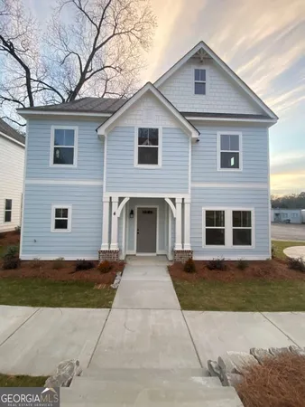 a front view of a house with yard