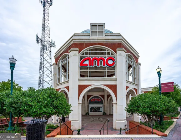 a front view of a building with garden