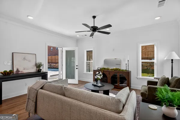 a living room with furniture and a fireplace