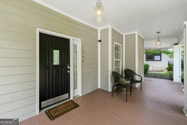a view of backyard with outdoor seating space