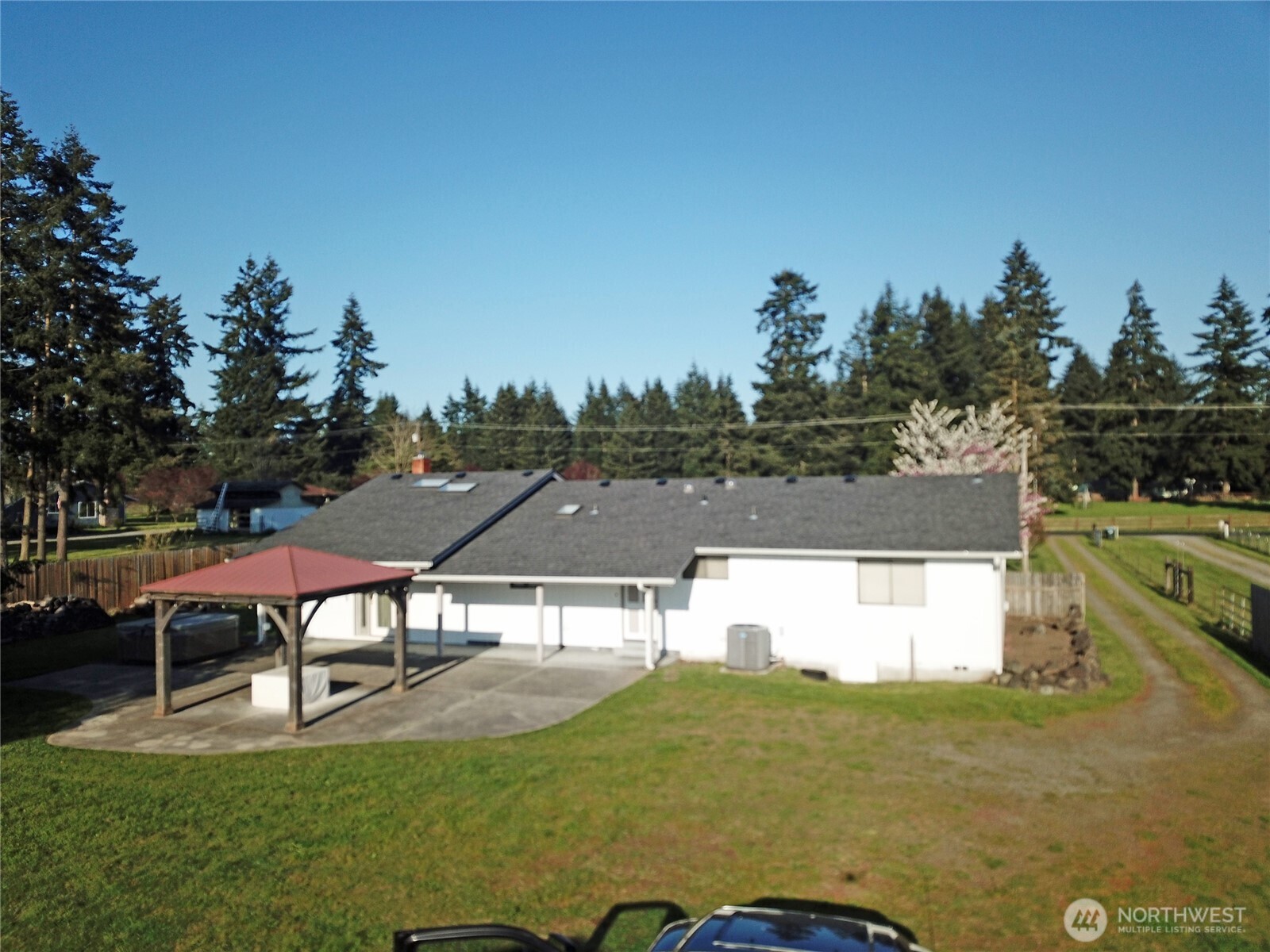 20025 Carper Road Southwest Rochester, WA 98579 - Photo 2 of 40 a view of a patio with table and chairs under an umbrella