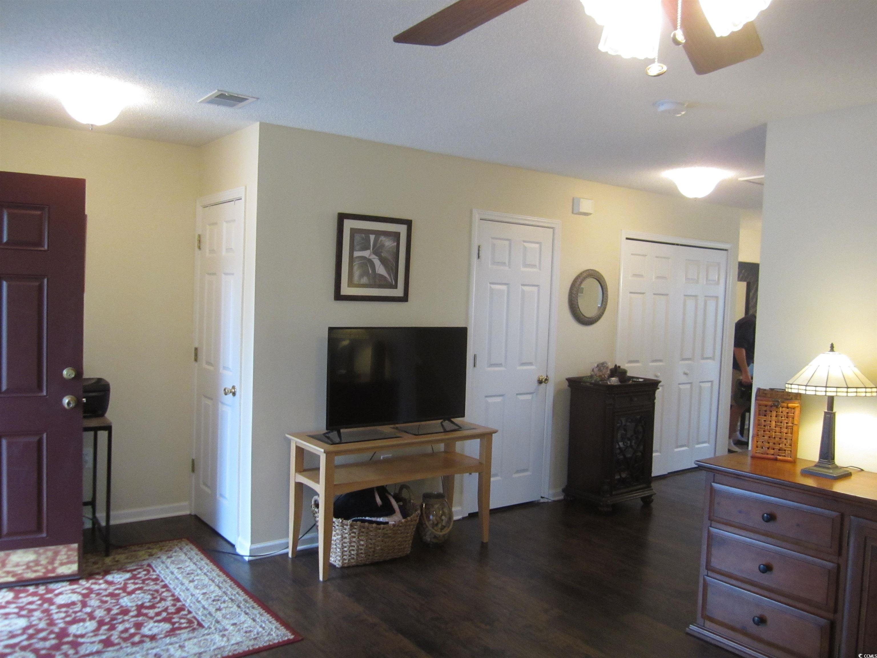 1071 Pinwheel Loop, Unit 1071 Myrtle Beach, SC 29577 - Photo 3 of 39 Interior space featuring ceiling fan and dark hard