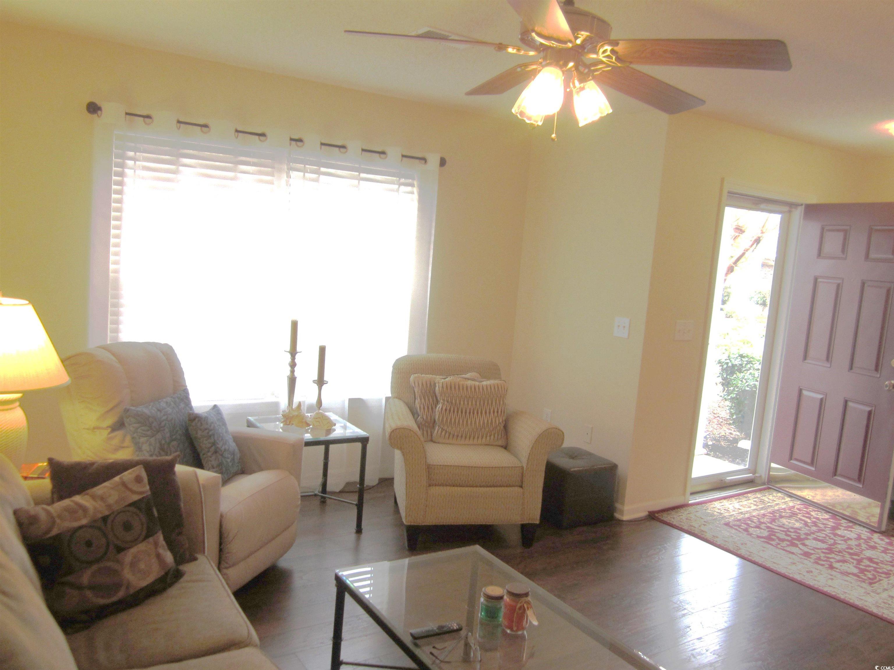 1071 Pinwheel Loop, Unit 1071 Myrtle Beach, SC 29577 - Photo 4 of 39 Living room featuring hardwood / wood-style floors