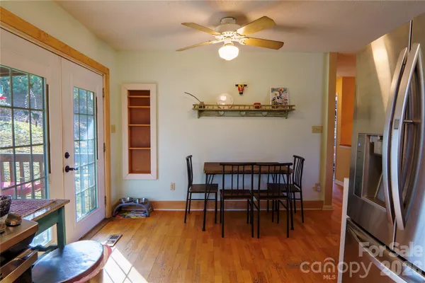a view of a dining room with furniture window and wooden floor