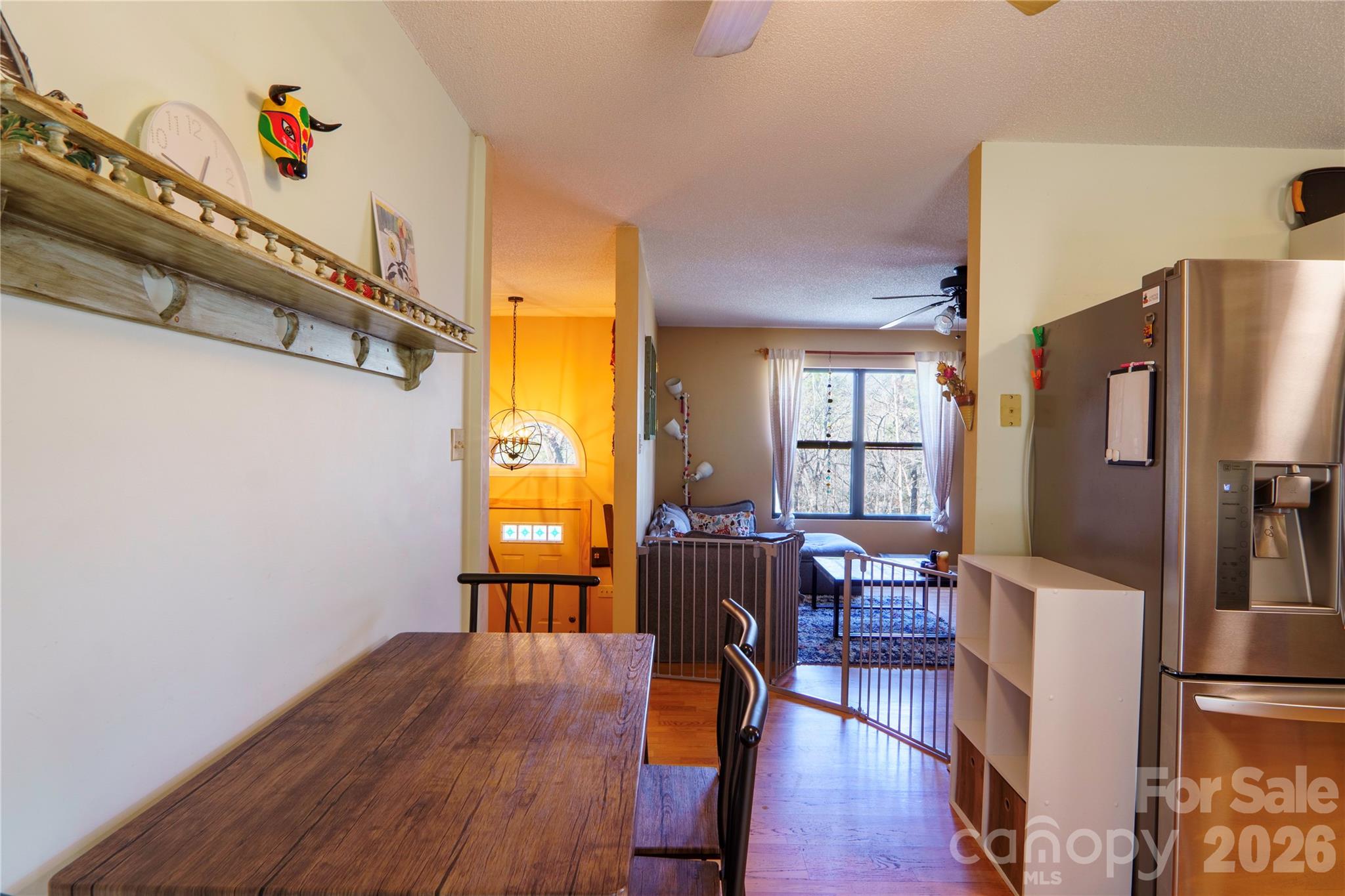 84 Forest Trail Balsam Grove, NC 28708 - Photo 20 of 45 a view of a dining room with furniture a chandelier and wooden floor