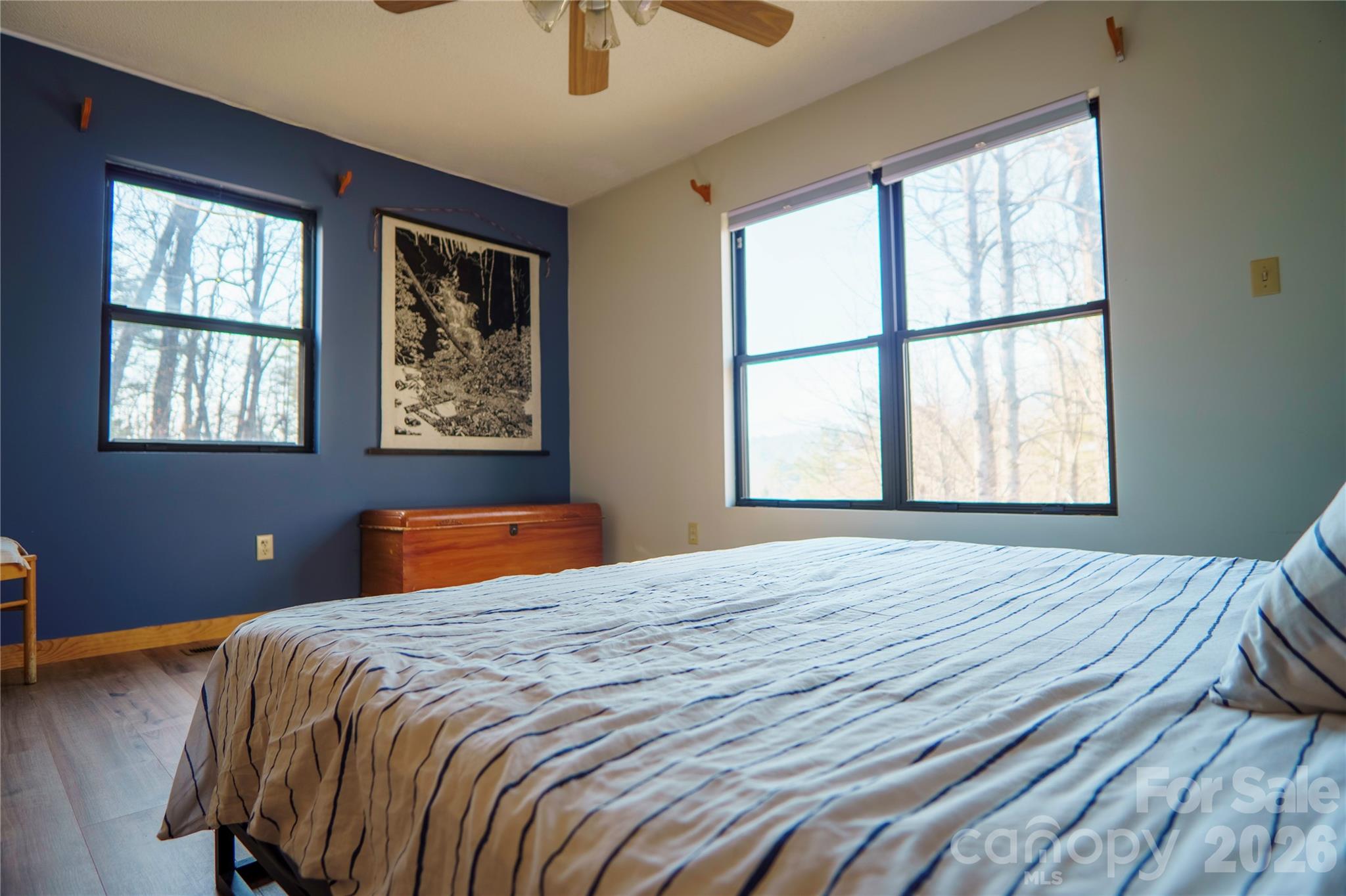 84 Forest Trail Balsam Grove, NC 28708 - Photo 22 of 45 a bedroom with a bed and wooden floor