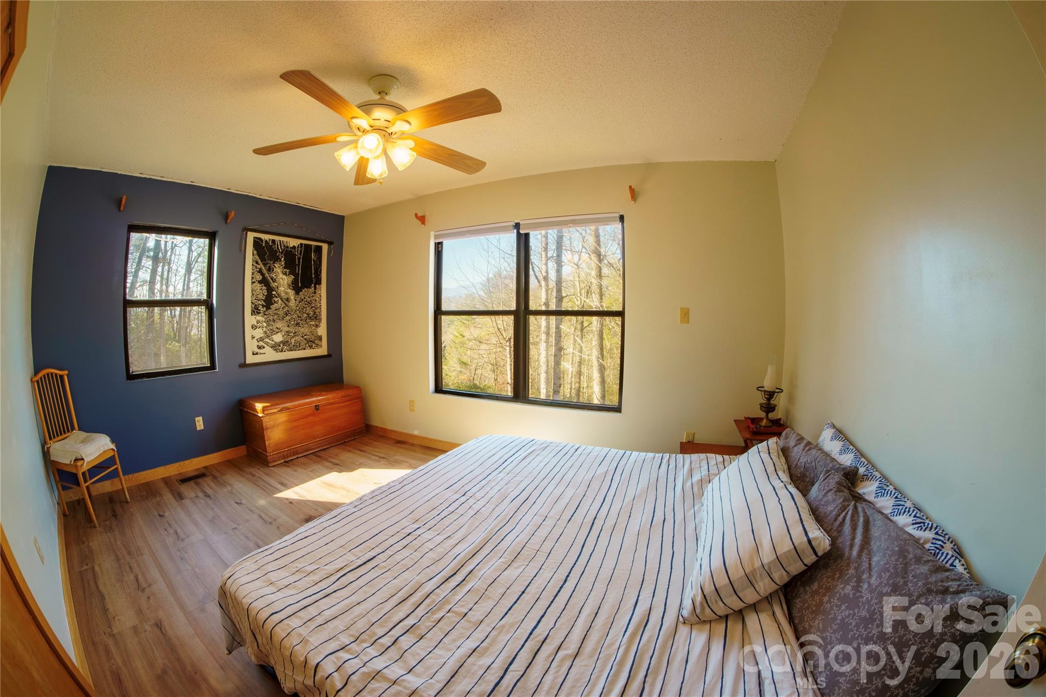84 Forest Trail Balsam Grove, NC 28708 - Photo 25 of 45 a bedroom with a bed and wooden floor
