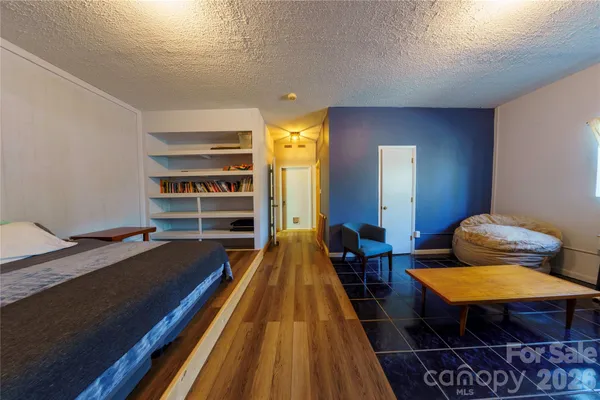 a bed room with a bed and furniture