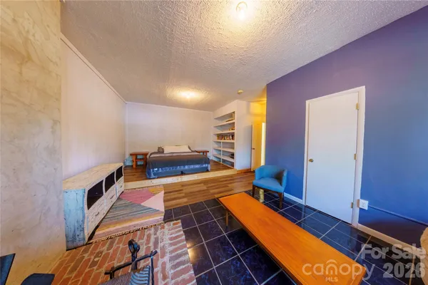 a room with wooden floor and furniture