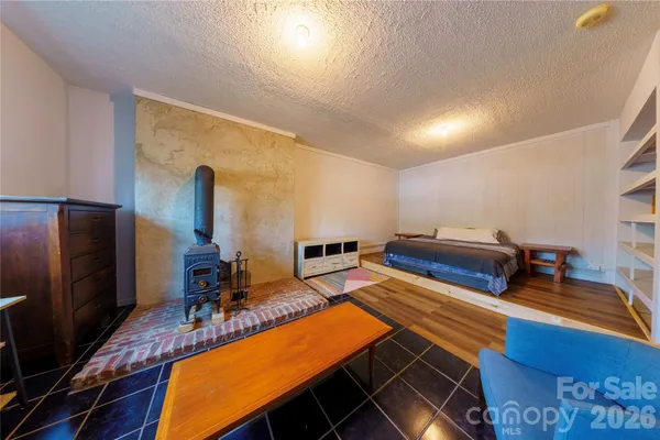 a room with furniture pool table and a flat screen tv