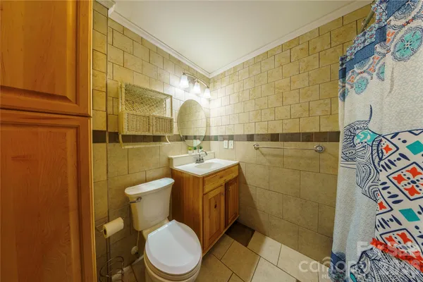 a bathroom with a toilet sink and shower