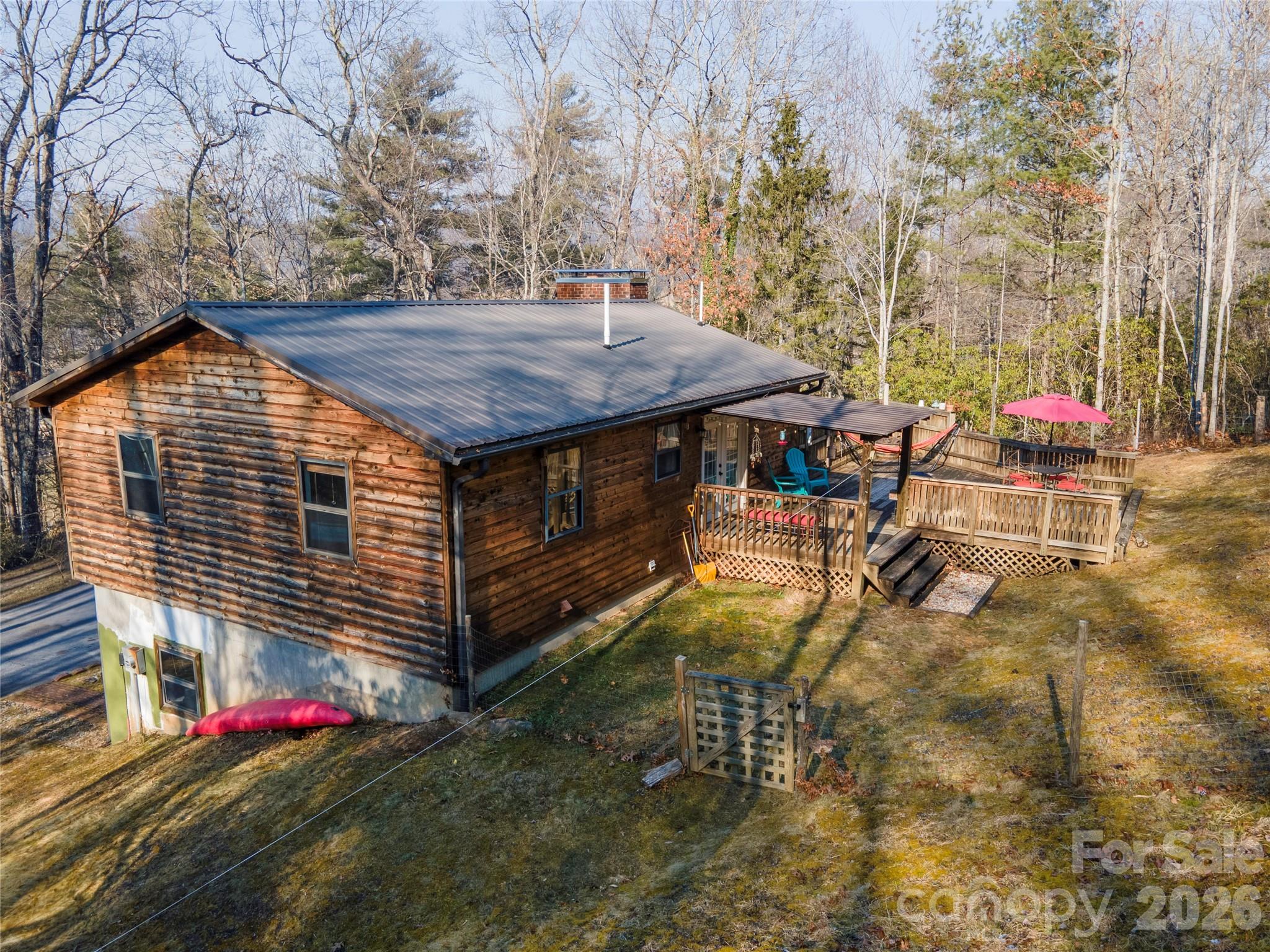 84 Forest Trail Balsam Grove, NC 28708 - Photo 4 of 45 a view of a wooden house with a yard