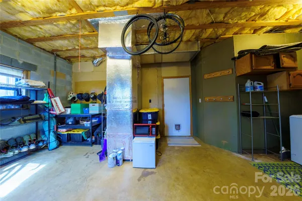 a view of a dry yard with mountains and valleys in the background