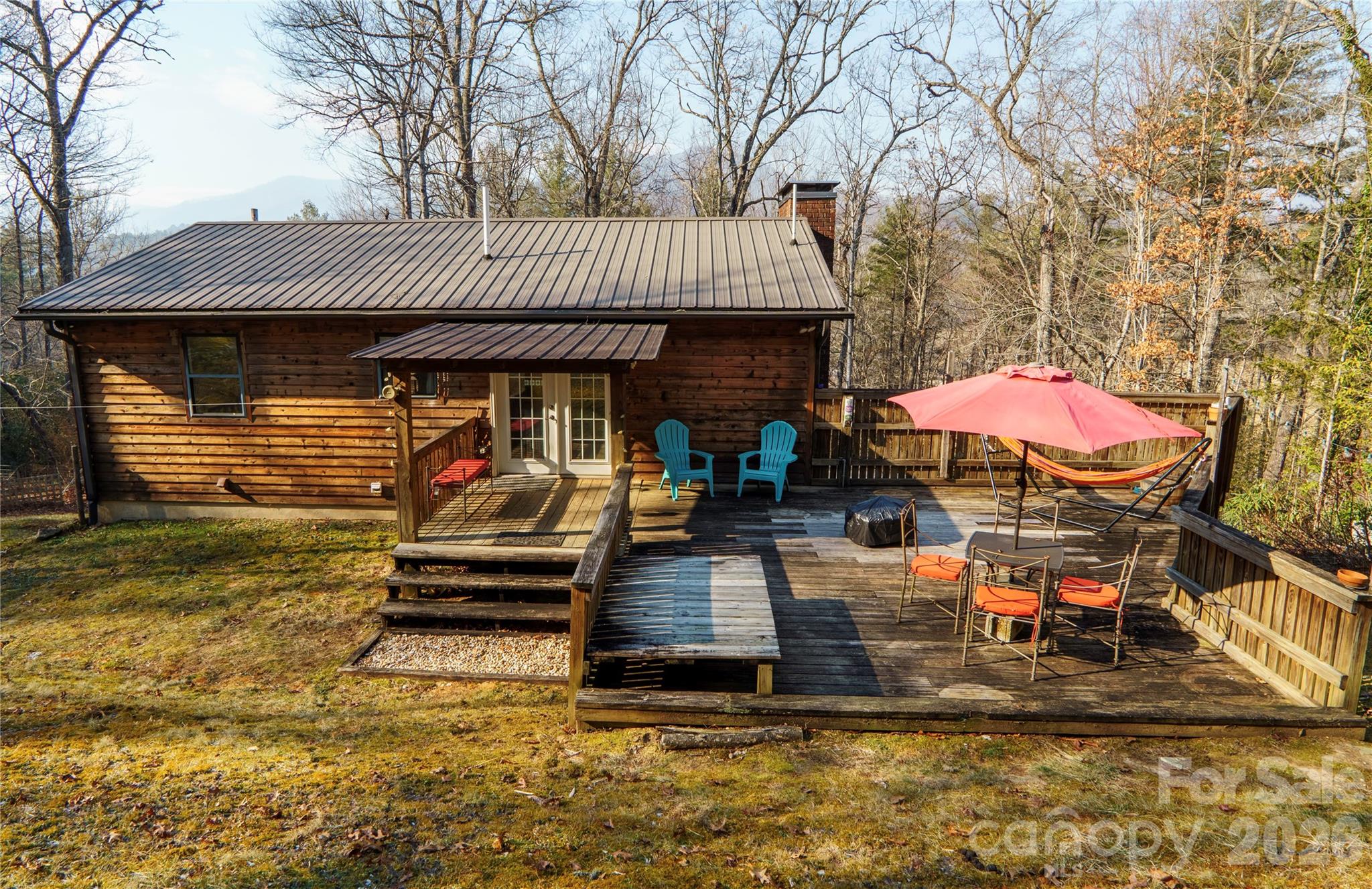 84 Forest Trail Balsam Grove, NC 28708 - Photo 5 of 45 a front view of a house with garden