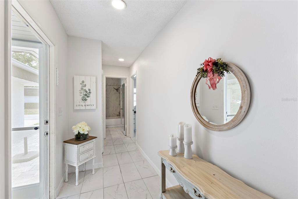 3978 Overlook Bend Terrace, Unit 25 Sarasota, FL 34232 - Photo 12 of 18 a very nice looking room with a mirror