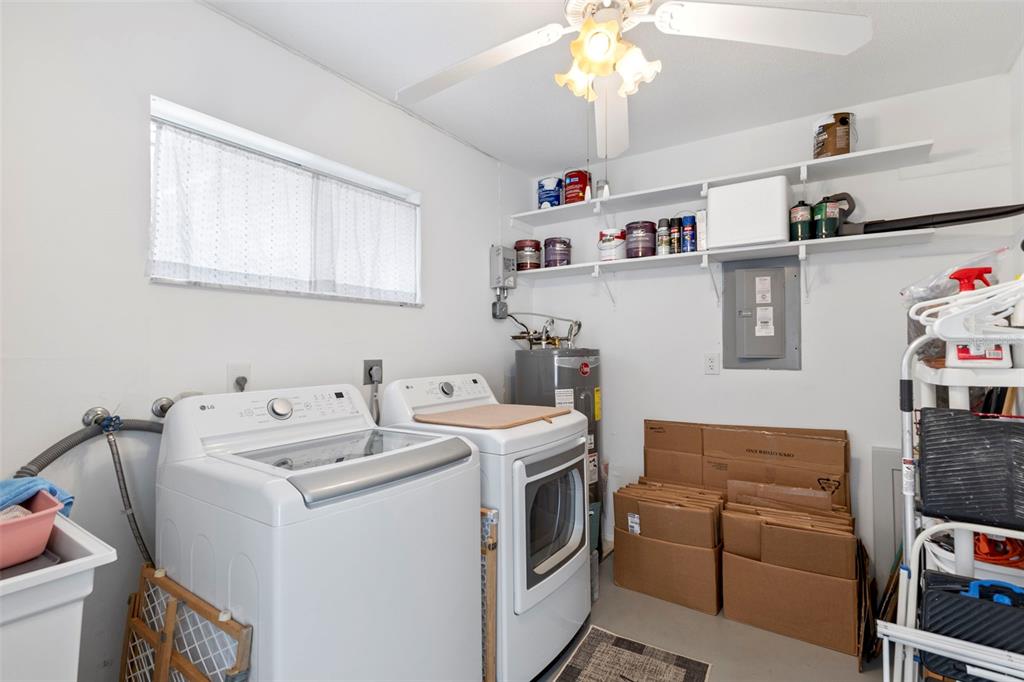 3978 Overlook Bend Terrace, Unit 25 Sarasota, FL 34232 - Photo 13 of 18 a utility room with dryer and washer