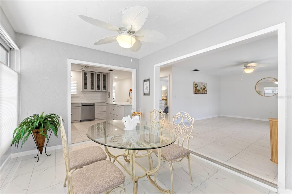 3978 Overlook Bend Terrace, Unit 25 Sarasota, FL 34232 - Photo 4 of 18 a view of a livingroom with furniture and a chandelier