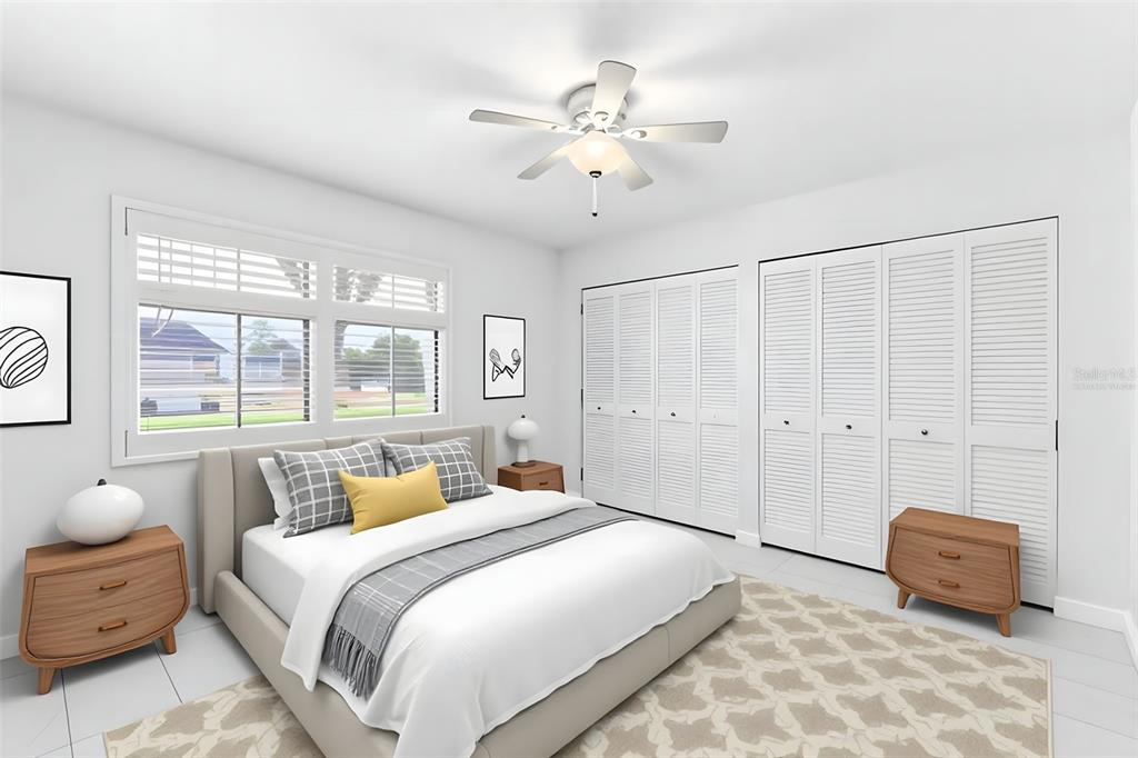 3978 Overlook Bend Terrace, Unit 25 Sarasota, FL 34232 - Photo 9 of 18 a bedroom with a bed and a chandelier