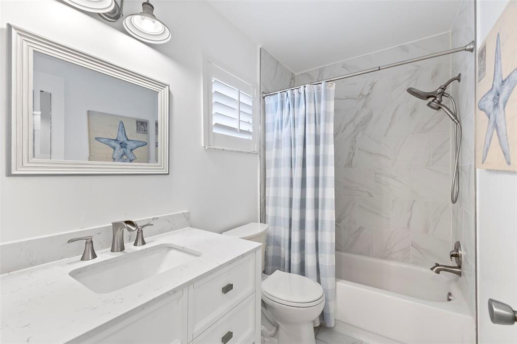3978 Overlook Bend Terrace, Unit 25 Sarasota, FL 34232 - Photo 10 of 18 a bathroom with a sink toilet and shower