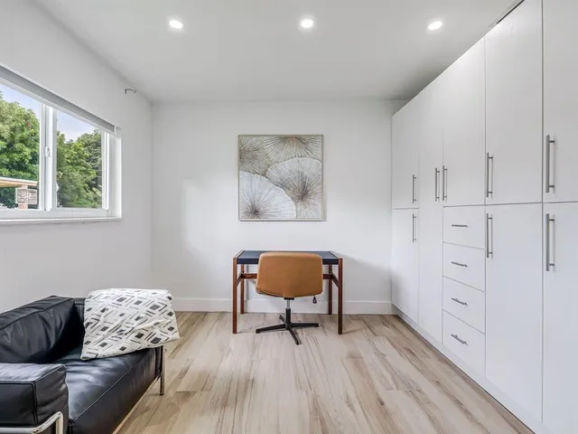 a living room with furniture and a chair