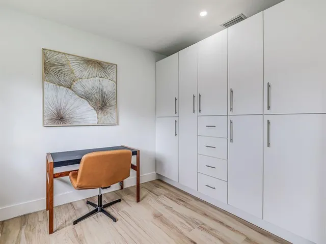 a view of room with furniture and wooden floor