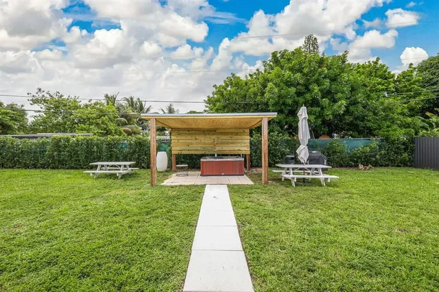 a view of a patio with a yard