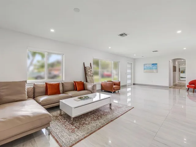 a living room with furniture and a table