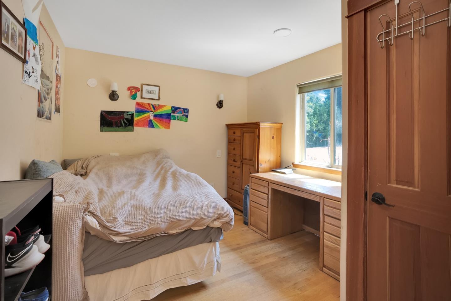 151 Rancho Road Watsonville, CA 95076 - Photo 12 of 56 a bedroom with a bed and a window