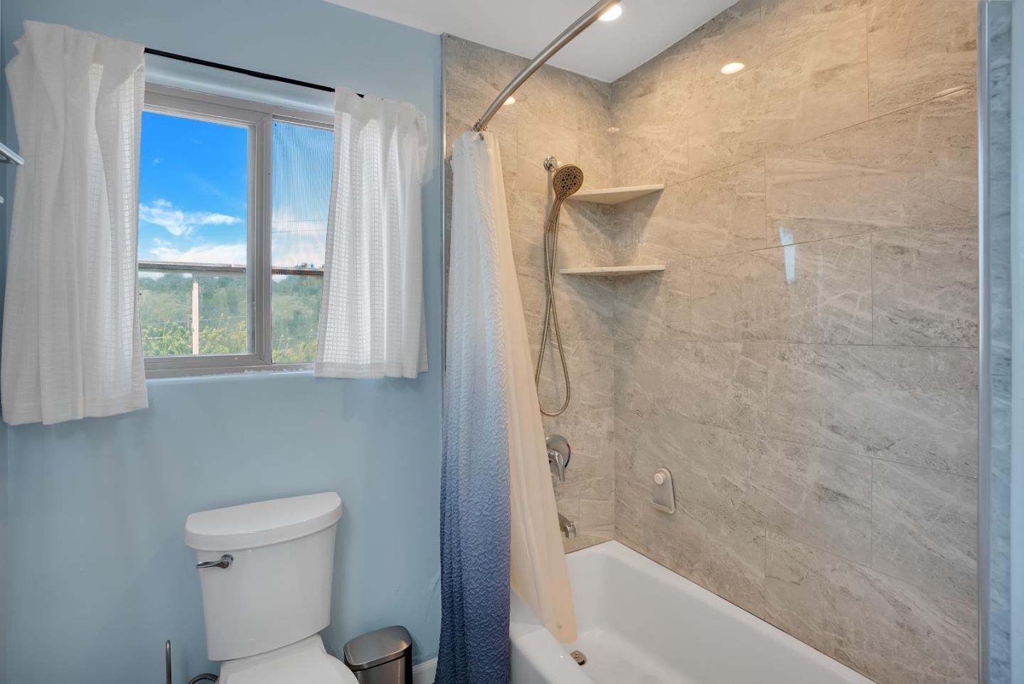 151 Rancho Road Watsonville, CA 95076 - Photo 15 of 56 a bathroom with a bathtub and a shower